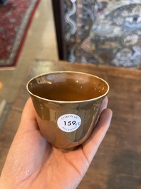 Five Chinese capucin brown ground cups and saucers with incised floral design, Qianlong