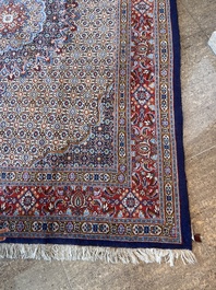 A Persian Moud rug with floral design, wool on cotton, 20th C.