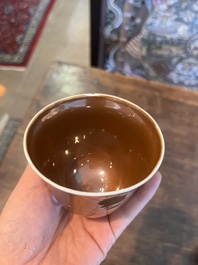 Five Chinese capucin brown ground cups and saucers with incised floral design, Qianlong