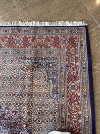 A Persian Moud rug with floral design, wool on cotton, 20th C.