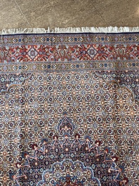 A Persian Moud rug with floral design, wool on cotton, 20th C.