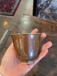 Five Chinese capucin brown ground cups and saucers with incised floral design, Qianlong
