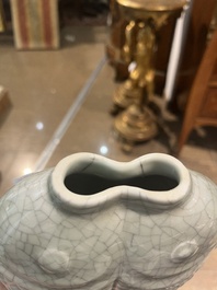 A pair of Chinese celadon glazed 'twin fish' vases, 19th/20th C.