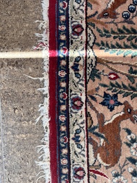 A Persian Tabriz 'tree of life' rug, wool on cotton, mid 20th C.