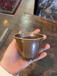 Five Chinese capucin brown ground cups and saucers with incised floral design, Qianlong