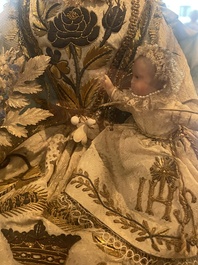 A Spanish polychrome decorated wax Madonna and Child adorned in brocade, 19th C.