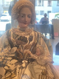 A Spanish polychrome decorated wax Madonna and Child adorned in brocade, 19th C.