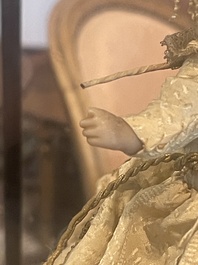A Spanish polychrome decorated wax Madonna and Child adorned in brocade, 19th C.