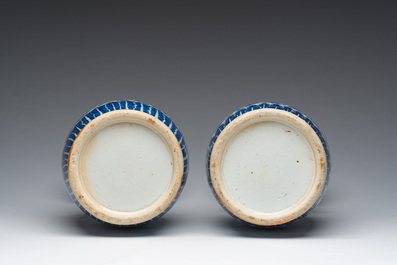 Twee Chinese blauw-witte vazen met lotusslingers en reli&euml;fdecor, 19de eeuw