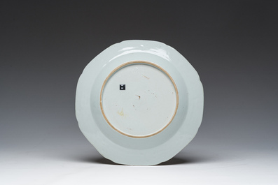 A Chinese octagonal famille rose 'Mandarin acrobat' plate, Qianlong