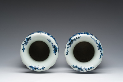 Twee Chinese blauw-witte vazen met lotusslingers en reli&euml;fdecor, 19de eeuw