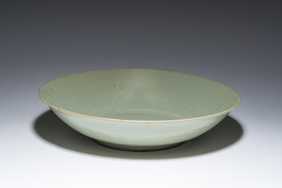 A Chinese Longquan celadon dish with incised floral design, Ming