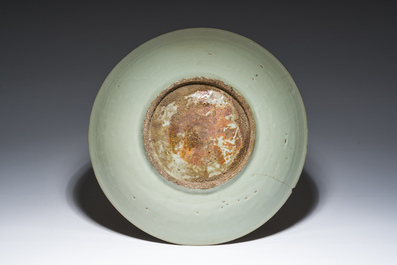A Chinese Longquan celadon dish with incised floral design, Ming