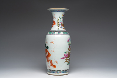 A Chinese famille rose and iron-red vase with a double design of antiquities and Buddhist lions, 19th C.