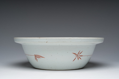 A large Chinese qianjiang cai bowl with ladies relaxing in a palace garden, 19th C.