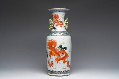A Chinese famille rose and iron-red vase with a double design of antiquities and Buddhist lions, 19th C.
