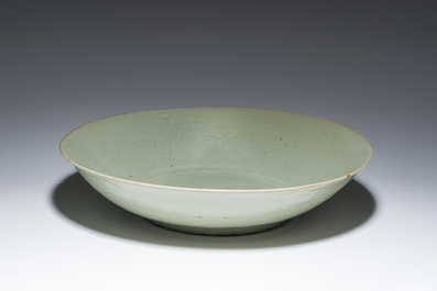 A Chinese Longquan celadon dish with incised floral design, Ming