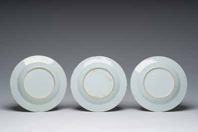 A Chinese blue and white dish and three famille rose plates with floral design, Kangxi/Qianlong