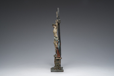 A Spanish polychrome decorated wooden crucifixion group with Jesus on the cross flanked by Mary and John the Evangelist, 18th C.