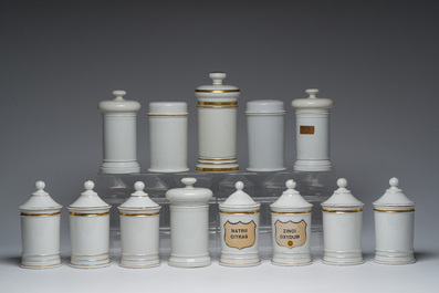 Thirteen Belgian and French gilt and polychrome decorated porcelain pharmacy jars and two bourdalous, 19th C.