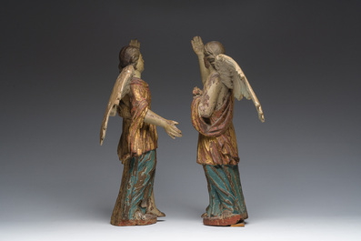 A pair of Italian gilt and polychrome decorated wooden angels, late 18th C.