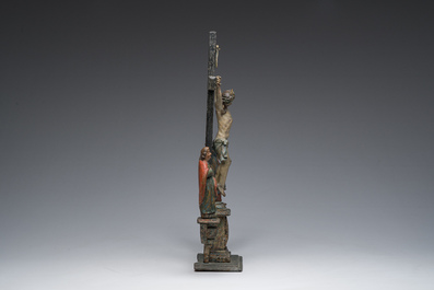 A Spanish polychrome decorated wooden crucifixion group with Jesus on the cross flanked by Mary and John the Evangelist, 18th C.