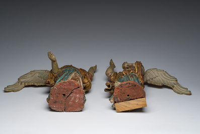 A pair of Italian gilt and polychrome decorated wooden angels, late 18th C.