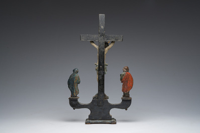 A Spanish polychrome decorated wooden crucifixion group with Jesus on the cross flanked by Mary and John the Evangelist, 18th C.