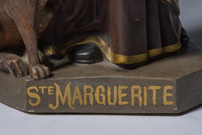 A polychrome decorated plaster figure of Saint Margaret with her dog, 19th/20th C.