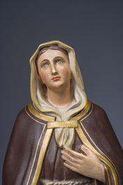 A polychrome decorated plaster figure of Saint Margaret with her dog, 19th/20th C.