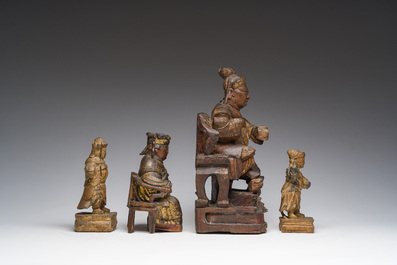 Four Chinese partially gilt and lacquered wooden 'Immortals' figures, a.o. Guandi, Qing