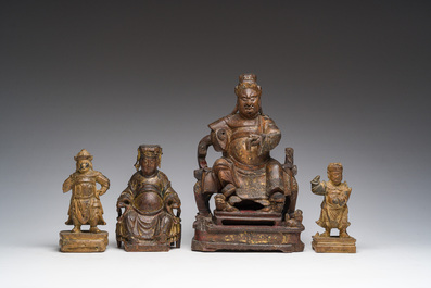 Four Chinese partially gilt and lacquered wooden 'Immortals' figures, a.o. Guandi, Qing