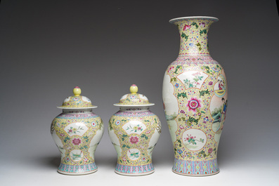 A Chinese famille rose yellow-ground baluster vase and a pair of vases and covers with animated scenes, Qianlong marks, Republic, 20th C.