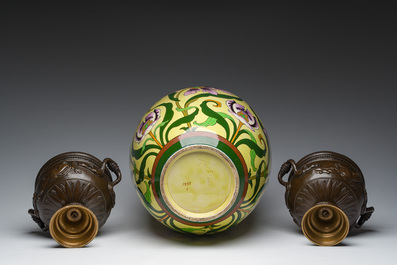 A Sarreguemines yellow-ground Art Nouveau vase with floral design and a pair of patinated bronze urns with 'nymphs' relief design, 20th C.