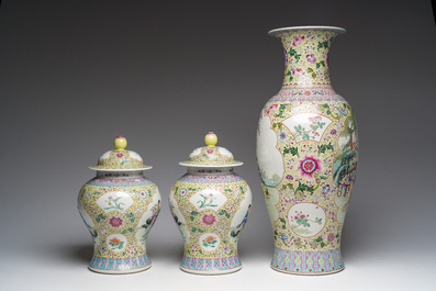 A Chinese famille rose yellow-ground baluster vase and a pair of vases and covers with animated scenes, Qianlong marks, Republic, 20th C.