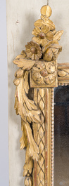 A French Louis XVI patinated and gilt wooden trumeau mirror, second half 18th C.