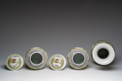 A Chinese famille rose yellow-ground baluster vase and a pair of vases and covers with animated scenes, Qianlong marks, Republic, 20th C.