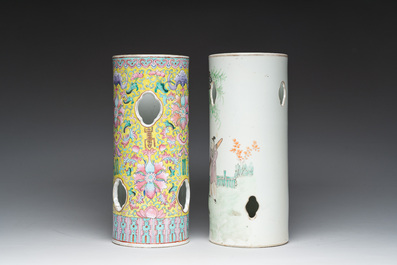 Two Chinese reticulated famille rose and qianjiang cai hat stands with figures in a landscape and floral design, 19th/20th c.