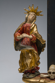 An Italian gilt and polychrome decorated wooden crucifixion group with Jesus on the cross flanked by Mary and John the Evangelist, 18th C.