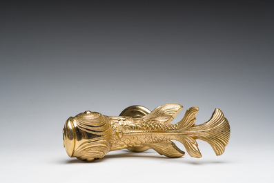 An Italian gilt bronze dolphin-shaped tap and two associated tap buckles, 20th C.