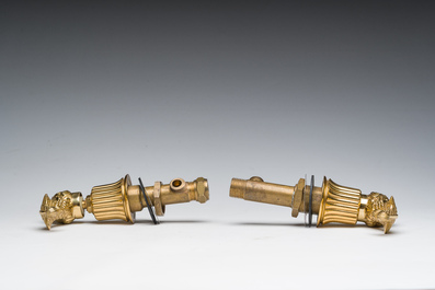 An Italian gilt bronze dolphin-shaped tap and two associated tap buckles, 20th C.