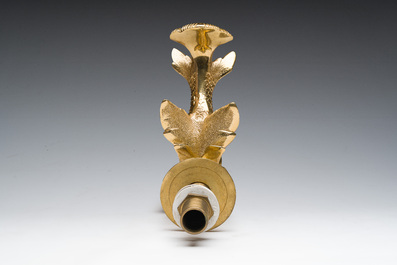 An Italian gilt bronze dolphin-shaped tap and two associated tap buckles, 20th C.