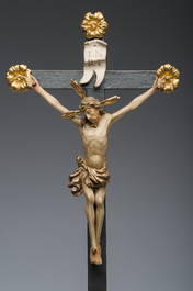 An Italian gilt and polychrome decorated wooden crucifixion group with Jesus on the cross flanked by Mary and John the Evangelist, 18th C.