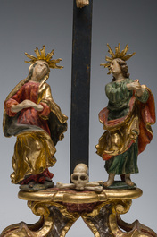 An Italian gilt and polychrome decorated wooden crucifixion group with Jesus on the cross flanked by Mary and John the Evangelist, 18th C.