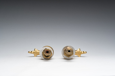 An Italian gilt bronze dolphin-shaped tap and two associated tap buckles, 20th C.