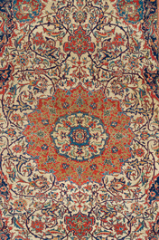 A Persian Isfahan rug with floral design, wool on cotton, 20th C.