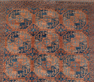 An Afghan rug with geometric design, wool on cotton, 20th C.
