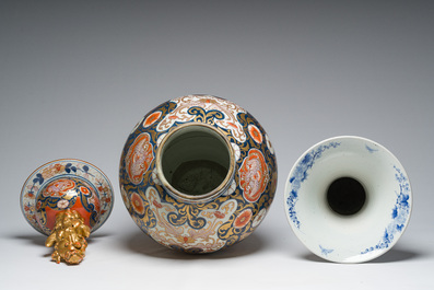 A Japanese blue and white Hirado vase with dragon relief design, an Imari vase and cover and a dish with floral design, Meiji, 19th/20th C.