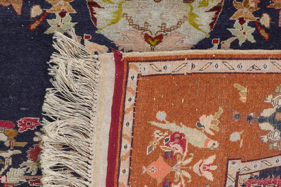 A Persian Isfahan rug and a Turkmen rug with floral design, wool, cotton and silk, 20th C.
