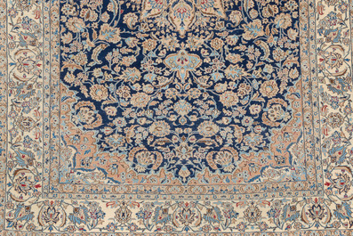 A Persian Nain rug with floral design, wool on cotton, 20th C.